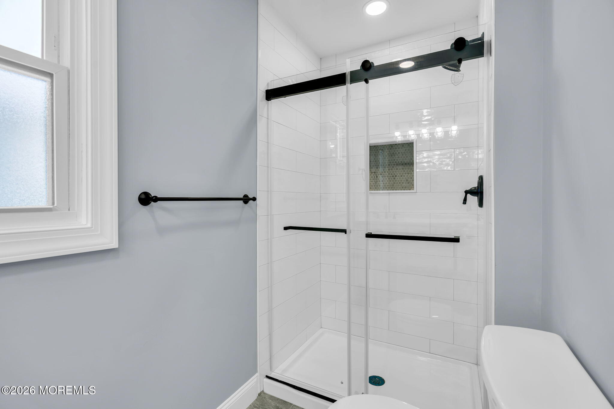 17 Meadowbrook Road Brick, NJ 08723 - Photo 26 of 36 a bathroom with a shower and a glass door