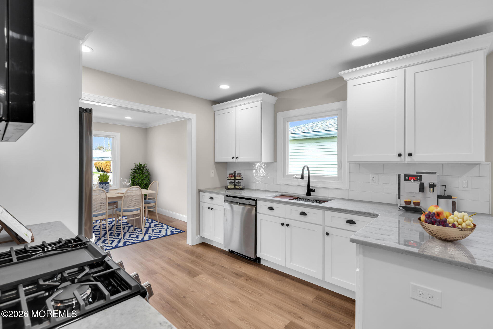 17 Meadowbrook Road Brick, NJ 08723 - Photo 3 of 36 a kitchen with a sink stove and cabinets