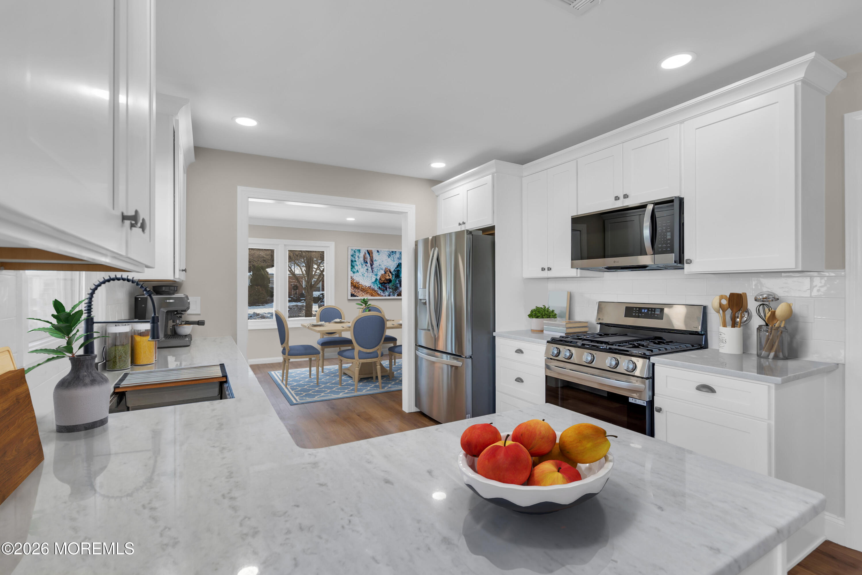 17 Meadowbrook Road Brick, NJ 08723 - Photo 7 of 36 a kitchen with stainless steel appliances kitchen island granite countertop a stove refrigerator and sink