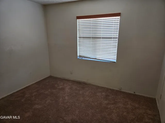 a view of a room that has a window in it