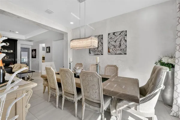 a large white kitchen with a large window