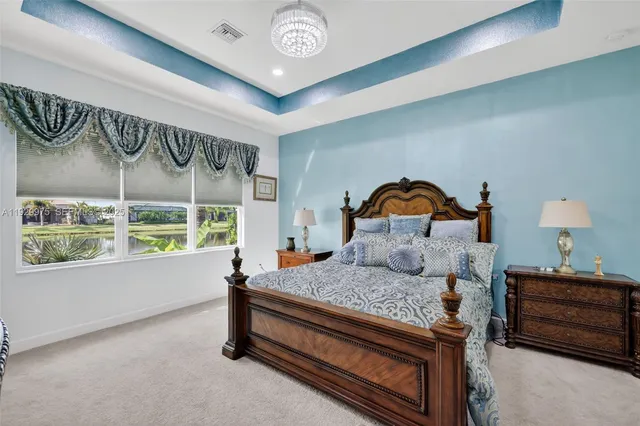 a spacious bathroom with a shower sink and mirror