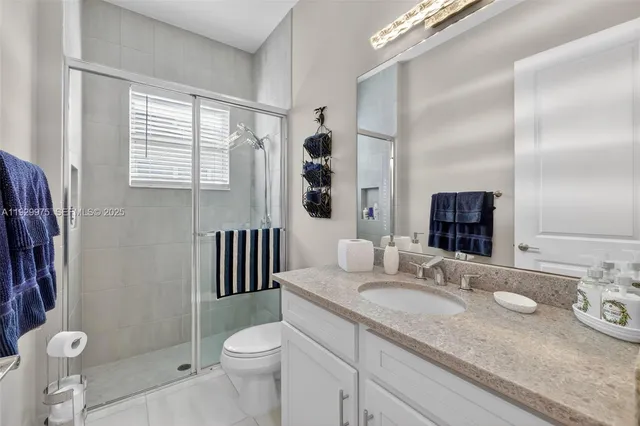 a view of a patio with table and chairs under an umbrella