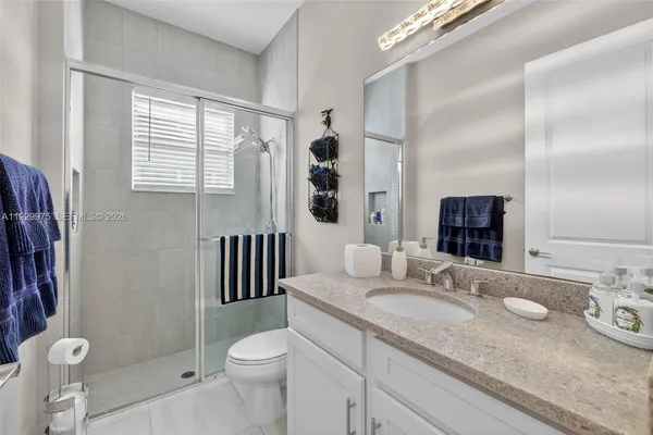 a view of a patio with a dining table and chairs