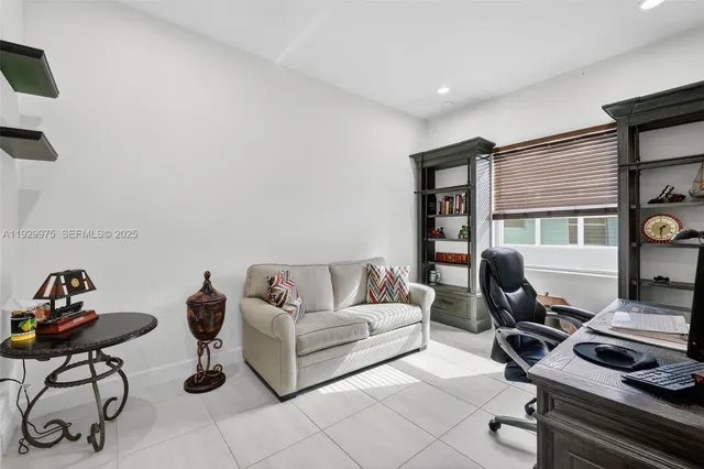 a view of a patio with a dining table and chairs