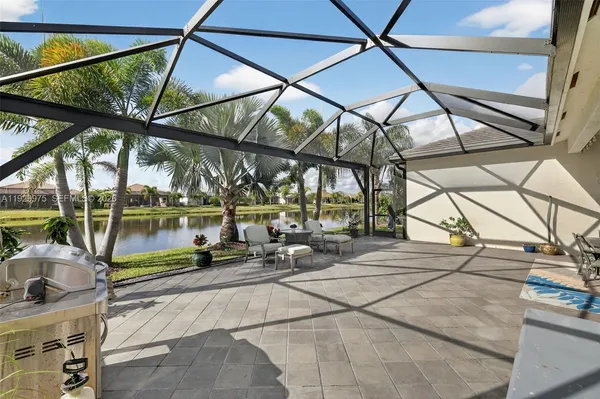 an aerial view of a house with a lake view