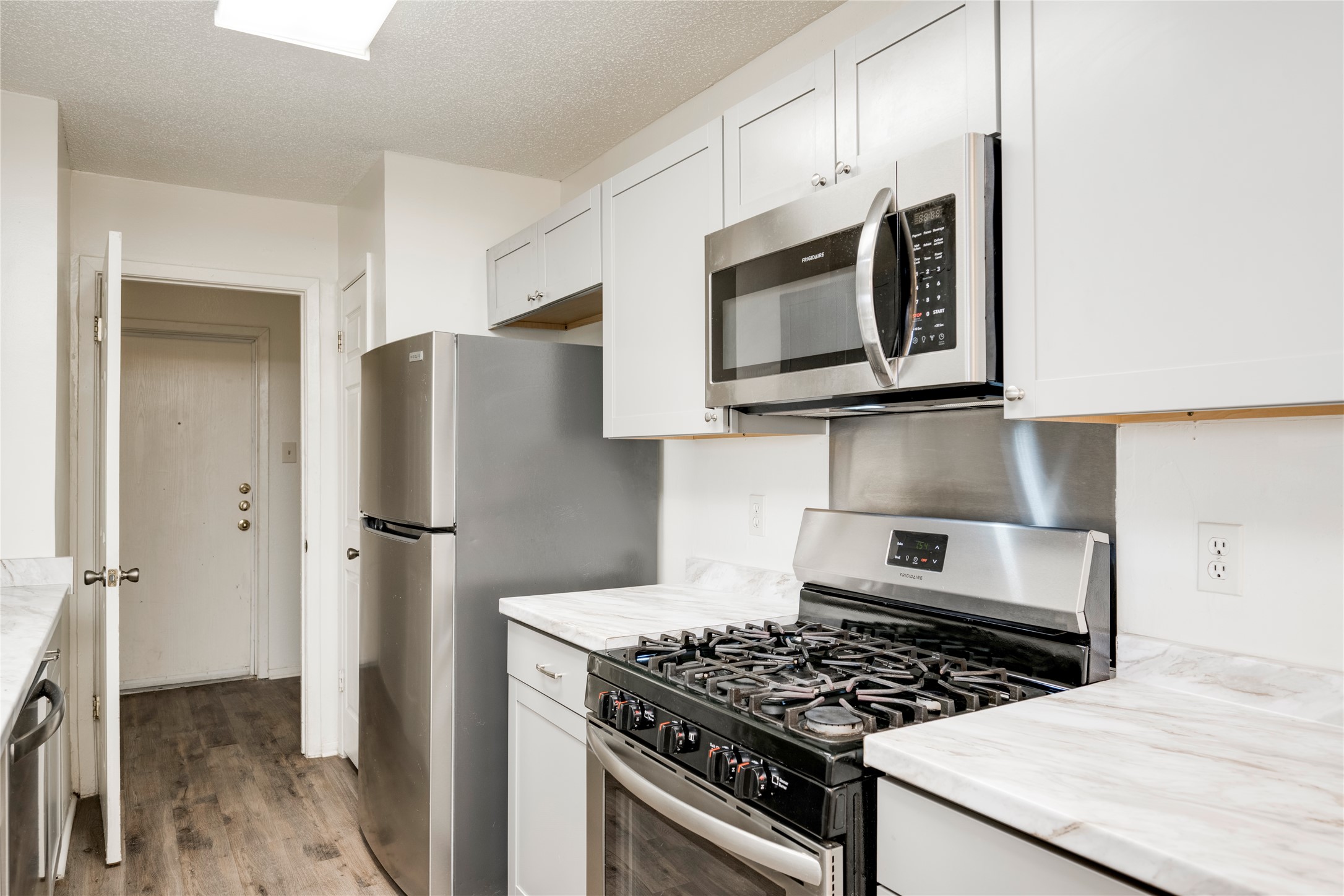 7918 West Gate Boulevard Austin, TX 78745 - Photo 21 of 31 A well-appointed kitchen features stainless steel appliances and abundant white cabinetry.