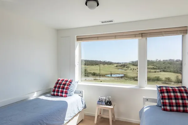 a bathroom with a sink mirror and vanity