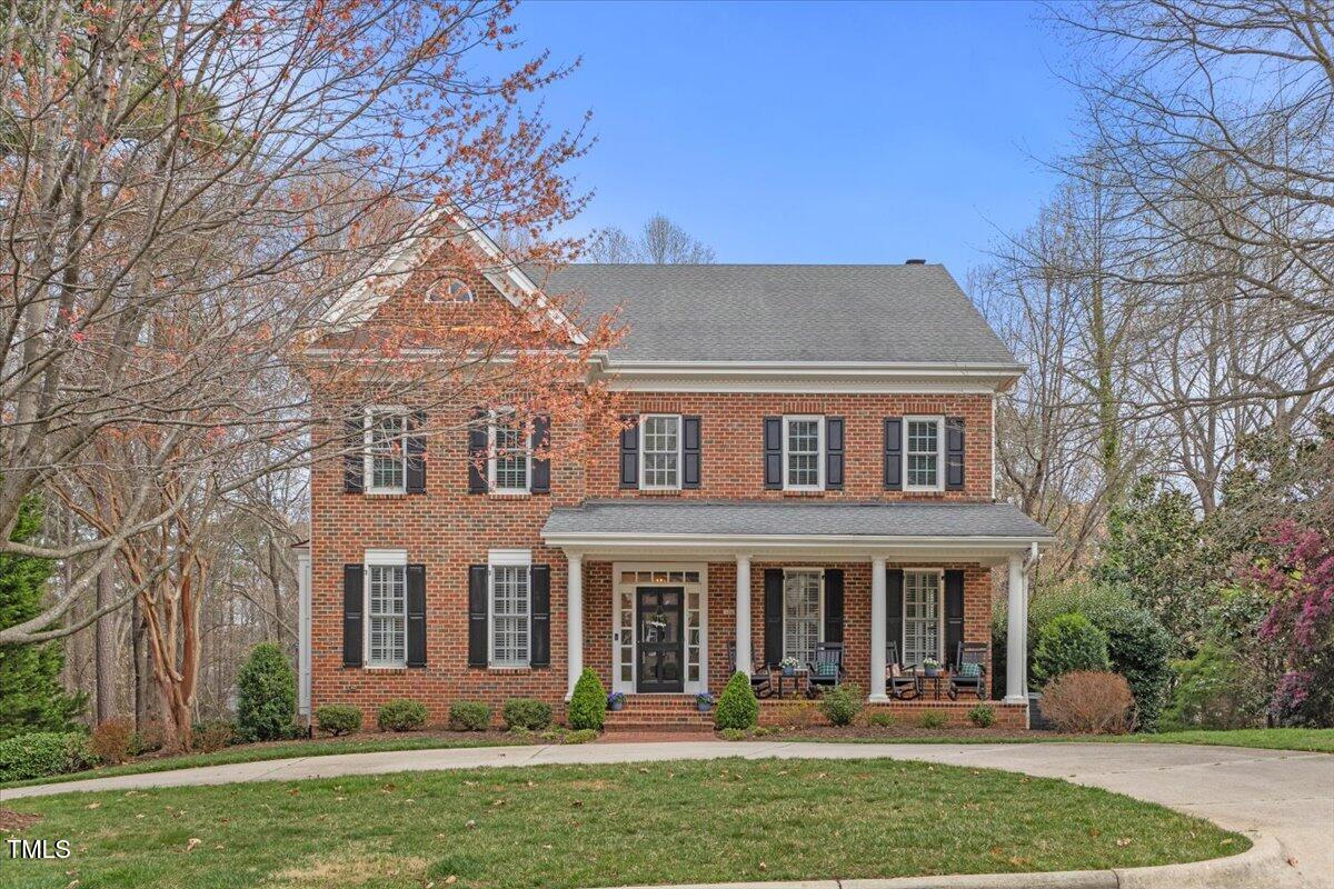 6116 Wilkinsburg Road Raleigh, NC 27612 - Photo 1 of 65 front view of a brick house with a yard