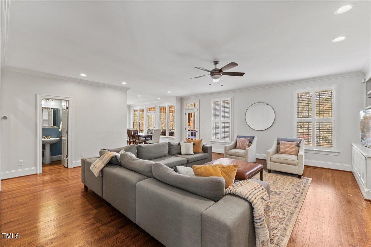 6116 Wilkinsburg Road Raleigh, NC 27612 - Photo 23 of 65 a living room with furniture and wooden floor