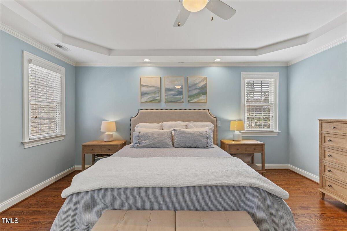 6116 Wilkinsburg Road Raleigh, NC 27612 - Photo 28 of 65 a bedroom with a bed a dresser and next to a window