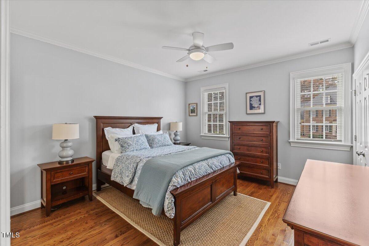 6116 Wilkinsburg Road Raleigh, NC 27612 - Photo 34 of 65 a bedroom with a bed and a table