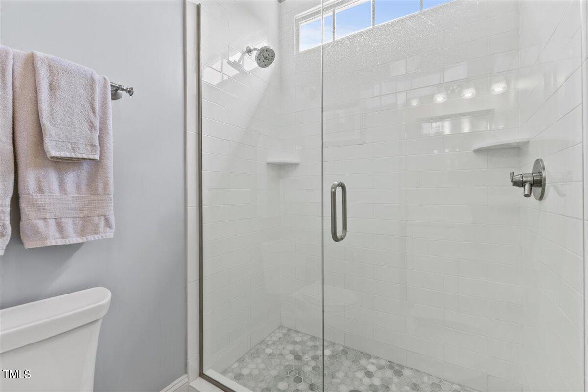 6116 Wilkinsburg Road Raleigh, NC 27612 - Photo 37 of 65 a bathroom with a shower