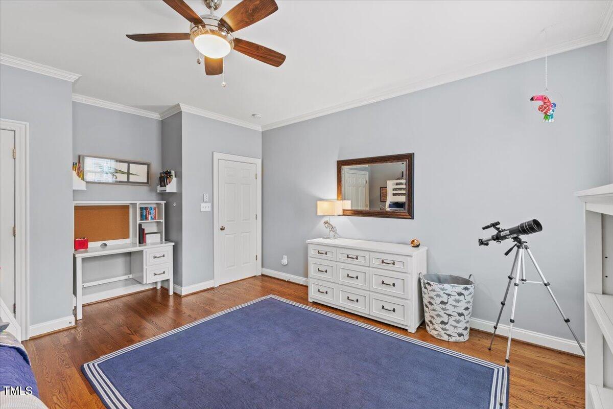 6116 Wilkinsburg Road Raleigh, NC 27612 - Photo 39 of 65 a living room with furniture and a flat screen tv