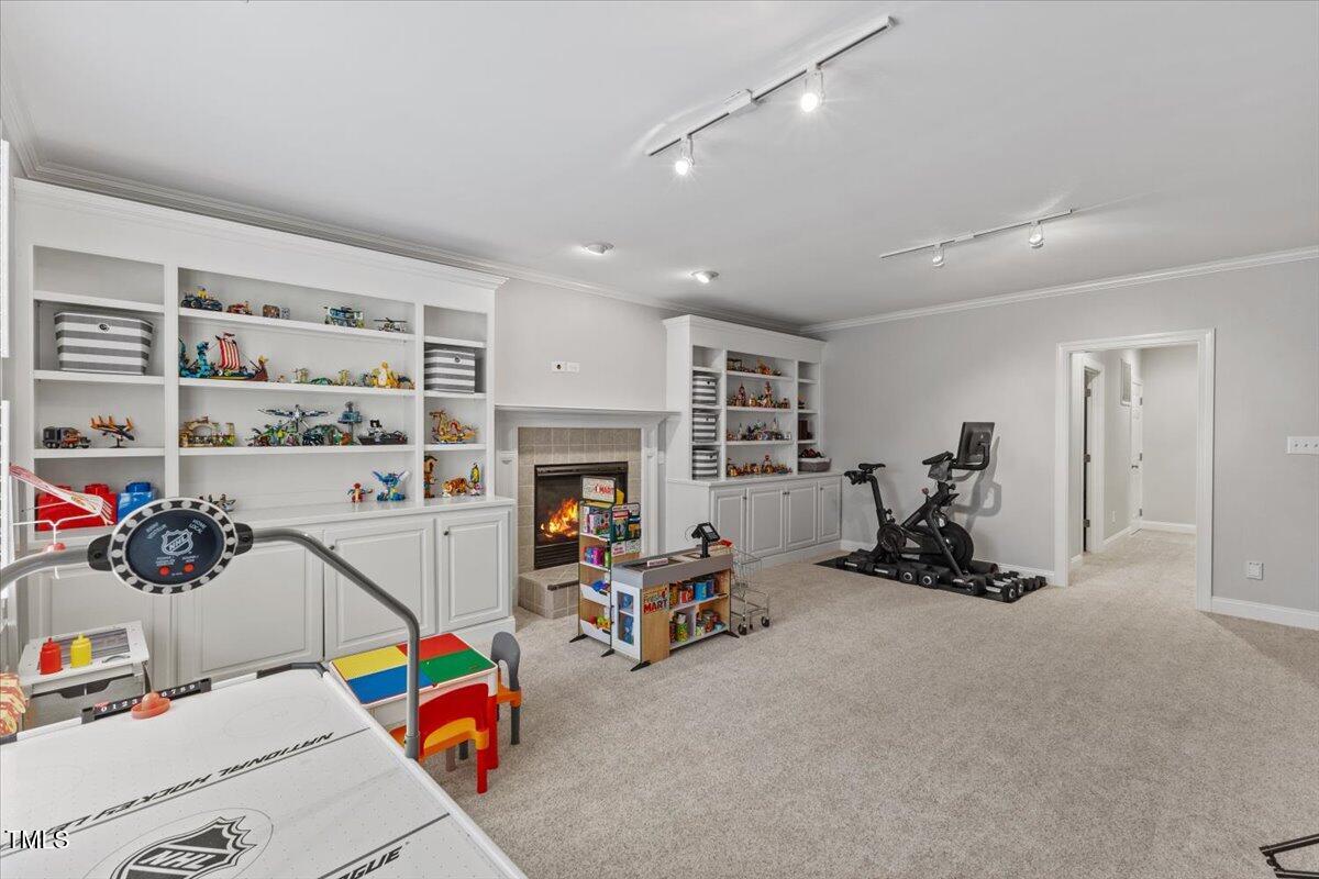 6116 Wilkinsburg Road Raleigh, NC 27612 - Photo 48 of 65 a view of a room with gym equipment