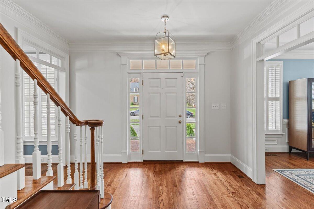 6116 Wilkinsburg Road Raleigh, NC 27612 - Photo 5 of 65 wooden floor in an empty room with a window