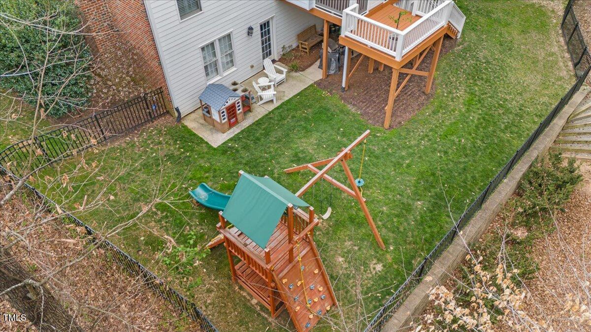 6116 Wilkinsburg Road Raleigh, NC 27612 - Photo 59 of 65 an aerial view of a house with garden space sitting space and deck