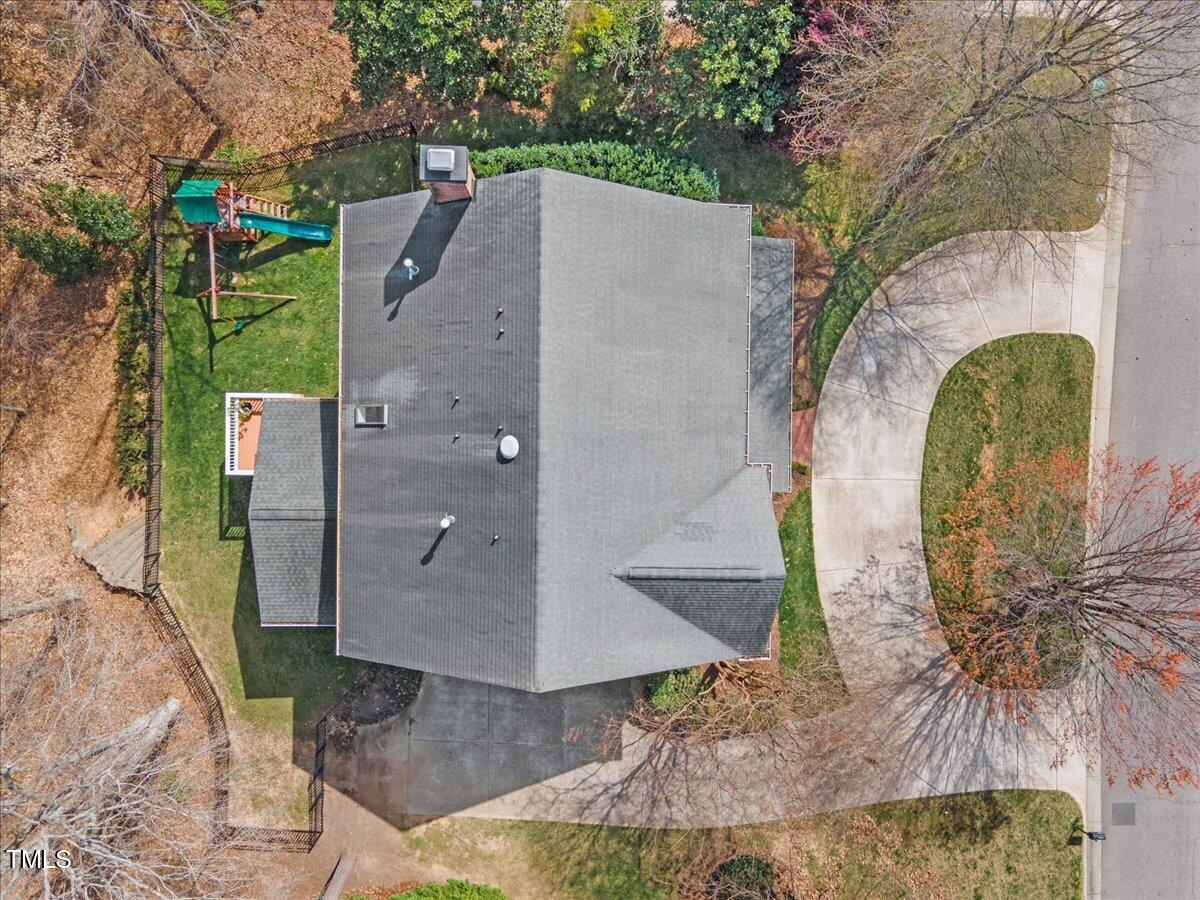 6116 Wilkinsburg Road Raleigh, NC 27612 - Photo 62 of 65 a aerial view of a house with large trees