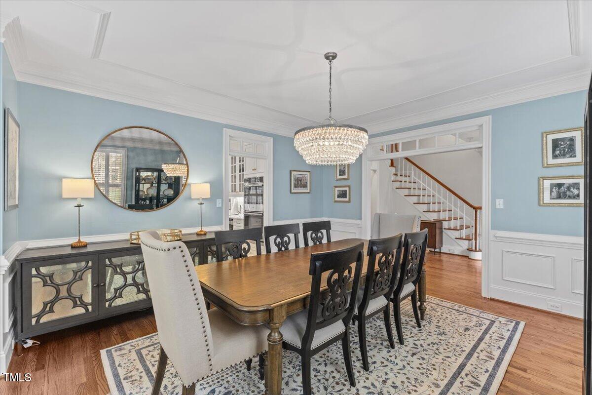 6116 Wilkinsburg Road Raleigh, NC 27612 - Photo 8 of 65 a view of a dining room with furniture window and wooden floor