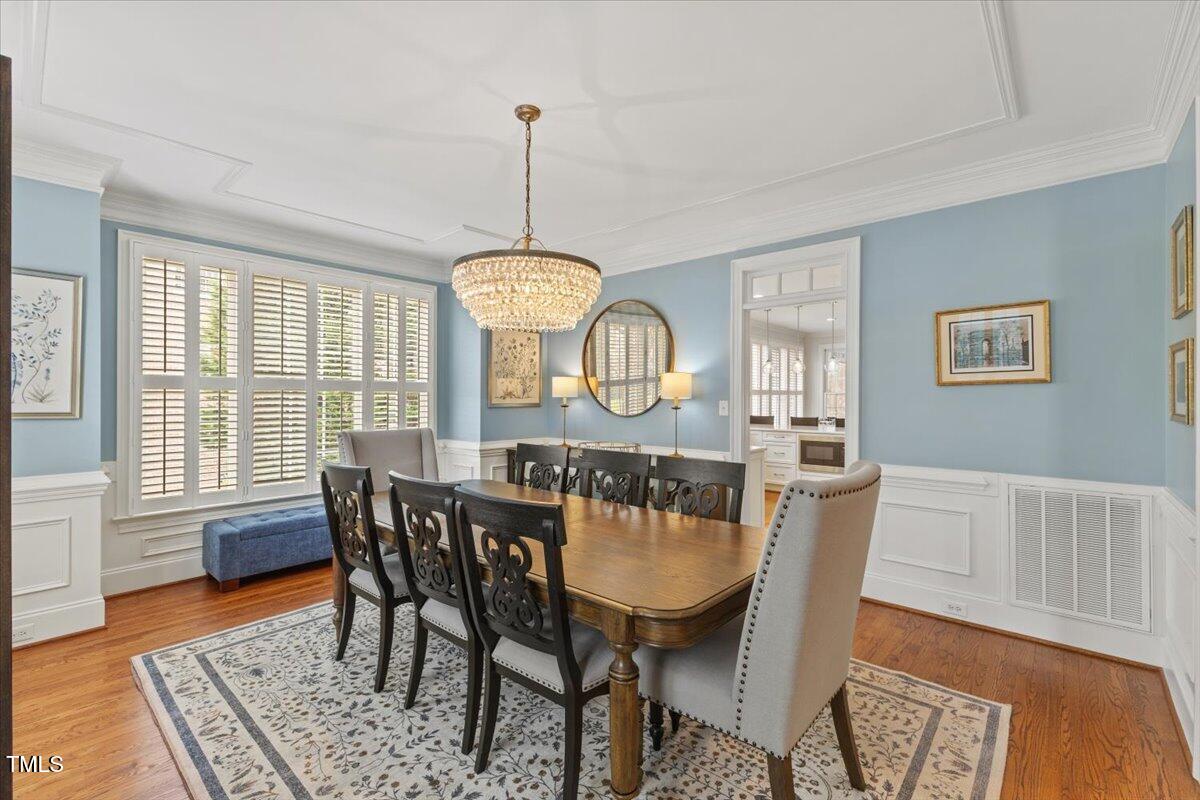 6116 Wilkinsburg Road Raleigh, NC 27612 - Photo 10 of 65 a view of a dining room with furniture window and wooden floor