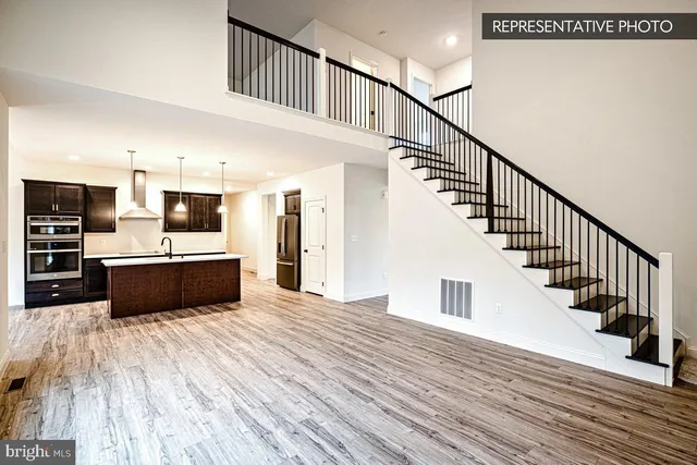 a view of kitchen with sink and microwave