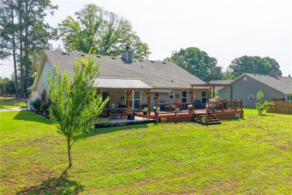 204 Lynn Road Bethlehem, GA 30620 - Photo 29 of 44 a view of a house with swimming pool and sitting area