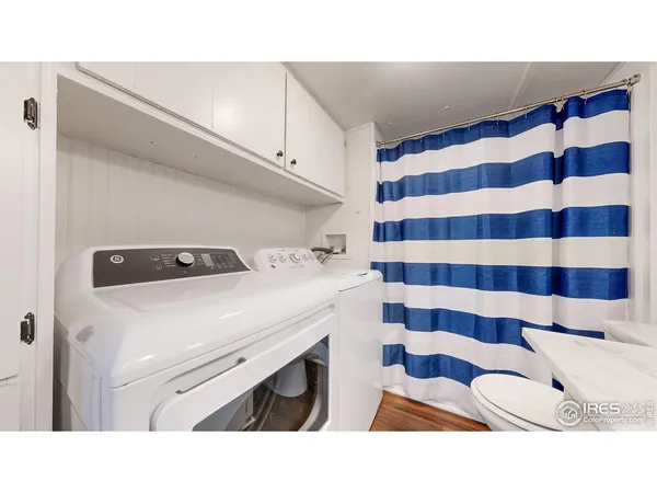 a utility room with a sink dryer and washer