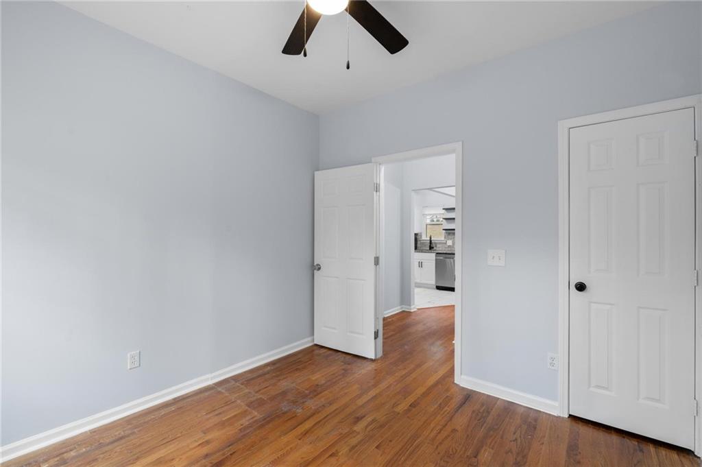 49 Harlan Road Southwest Atlanta, GA 30311 - Photo 13 of 38 wooden floor in an empty room with a empty space