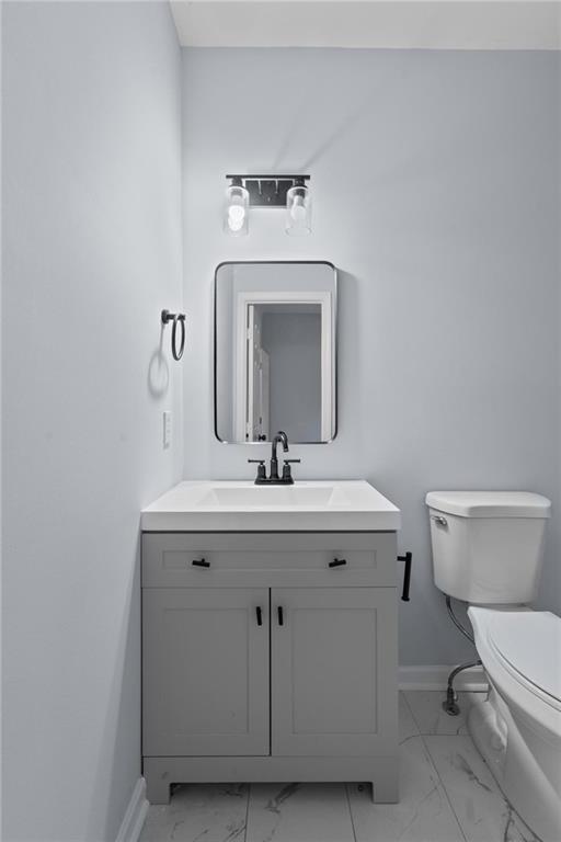 49 Harlan Road Southwest Atlanta, GA 30311 - Photo 14 of 38 a bathroom with a toilet a sink and mirror