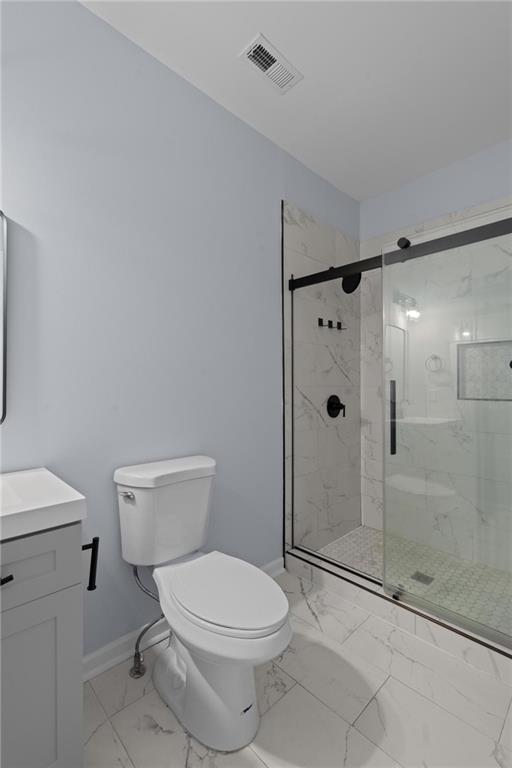 49 Harlan Road Southwest Atlanta, GA 30311 - Photo 15 of 38 a bathroom with a toilet and a shower