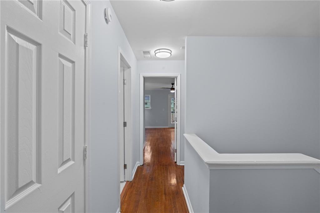 49 Harlan Road Southwest Atlanta, GA 30311 - Photo 17 of 38 a view of a hallway with wooden floor and closet
