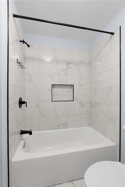 49 Harlan Road Southwest Atlanta, GA 30311 - Photo 19 of 38 a bathroom with a shower and a bath tub
