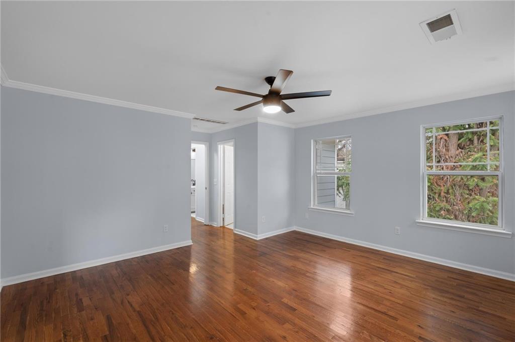49 Harlan Road Southwest Atlanta, GA 30311 - Photo 20 of 38 a view of an empty room with wooden floor and a window