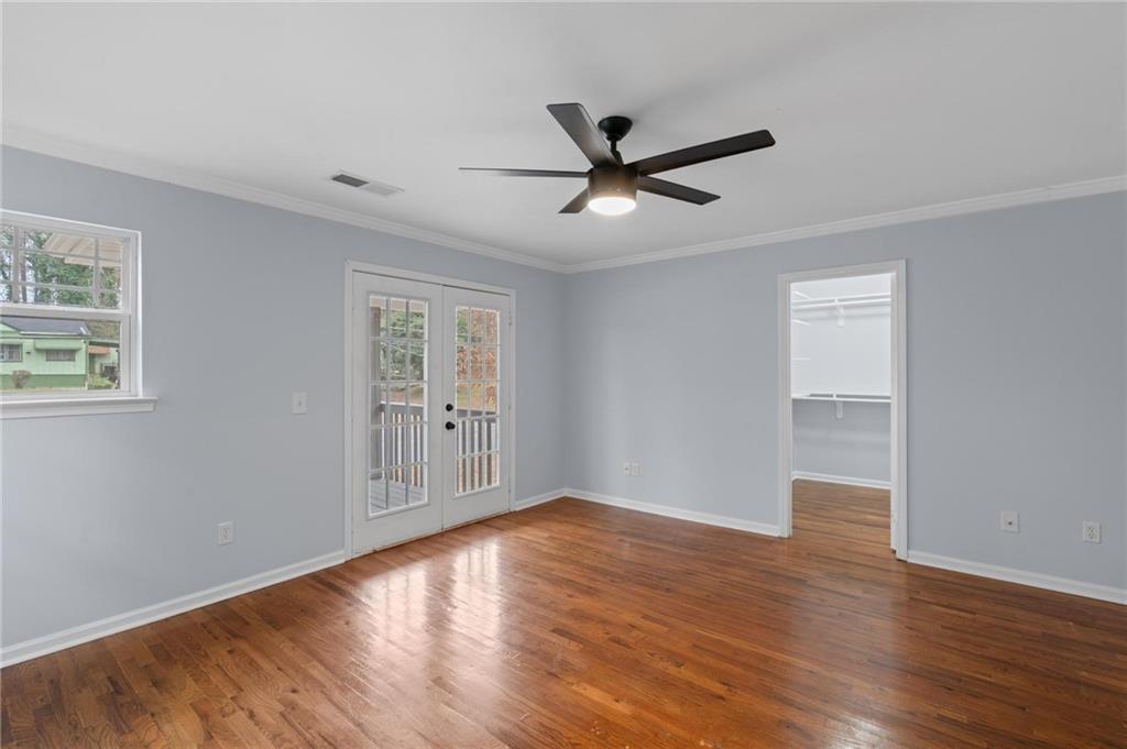 49 Harlan Road Southwest Atlanta, GA 30311 - Photo 21 of 38 a view of empty room with wooden floor and fan