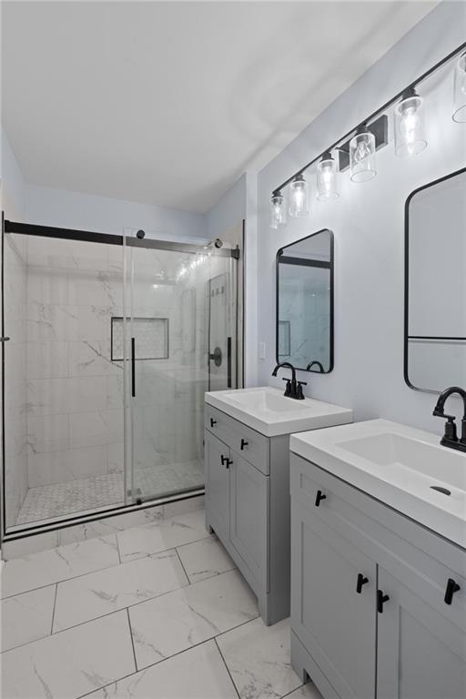 49 Harlan Road Southwest Atlanta, GA 30311 - Photo 24 of 38 a spacious bathroom with a double vanity sink mirror and shower