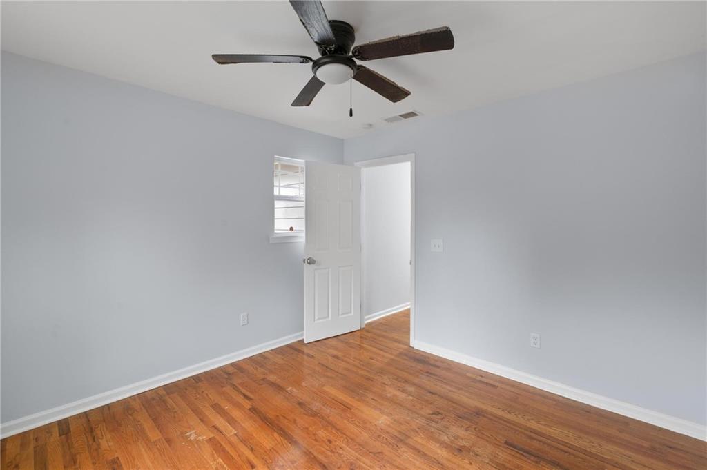49 Harlan Road Southwest Atlanta, GA 30311 - Photo 31 of 38 a view of empty room with wooden floor