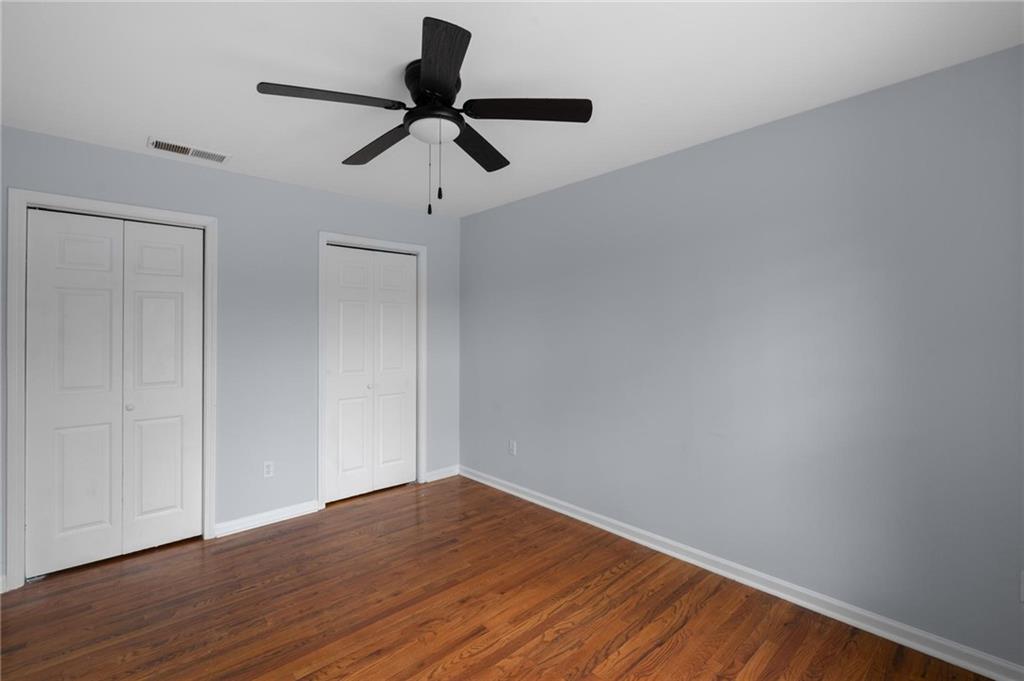 49 Harlan Road Southwest Atlanta, GA 30311 - Photo 32 of 38 a view of empty room with wooden floor