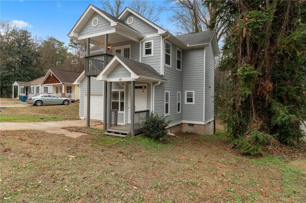 49 Harlan Road Southwest Atlanta, GA 30311 - Photo 35 of 38 a front view of a house with garden