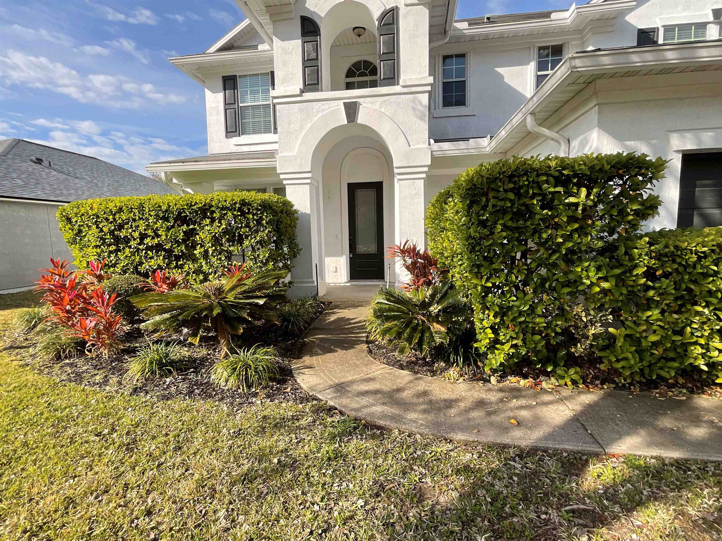 a front view of a house with a yard
