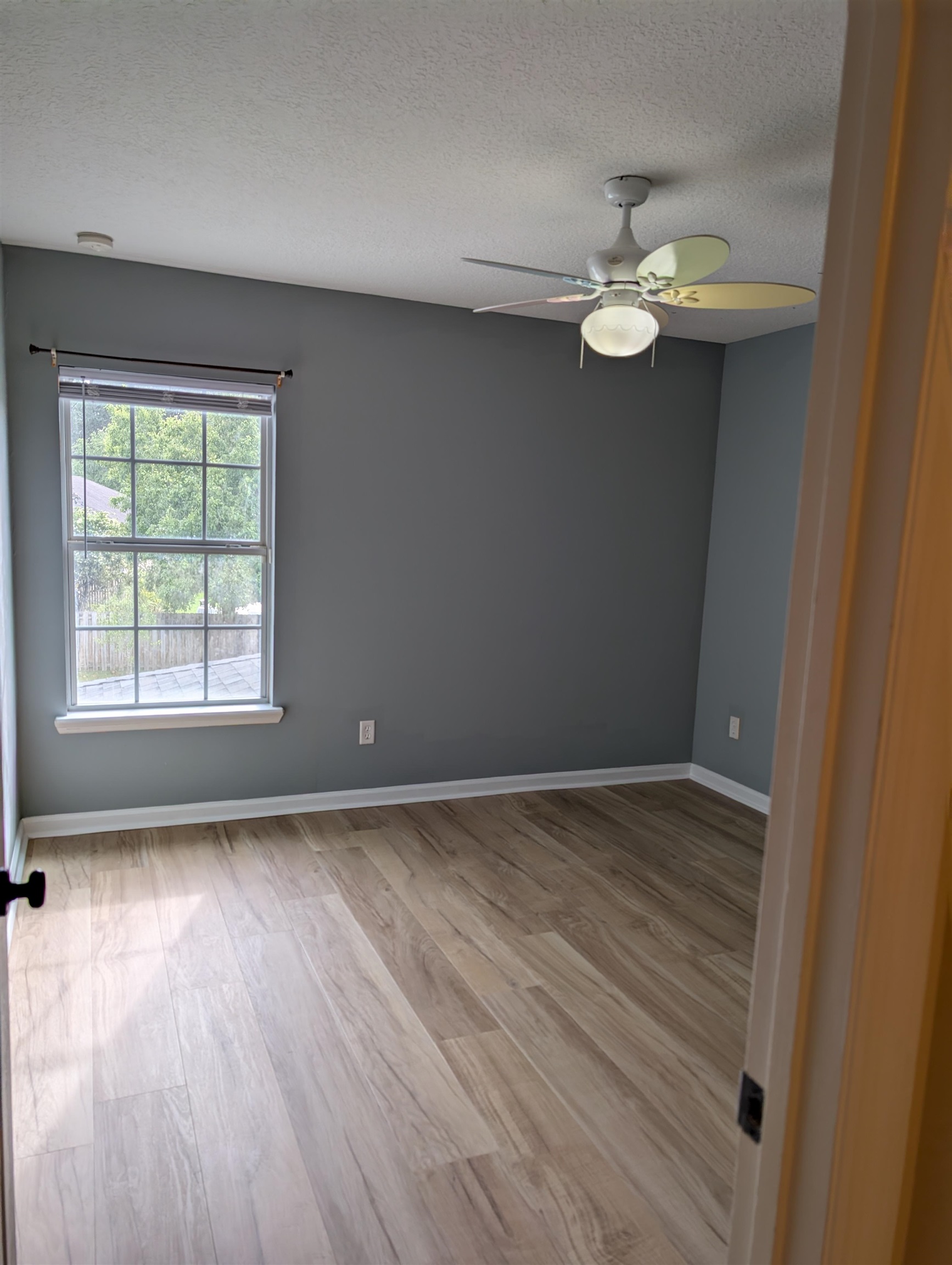 133 Camden Cay Drive St. Augustine, FL 32086 - Photo 16 of 33 an empty room with wooden floor and windows