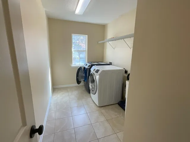 a utility room with dryer and washer