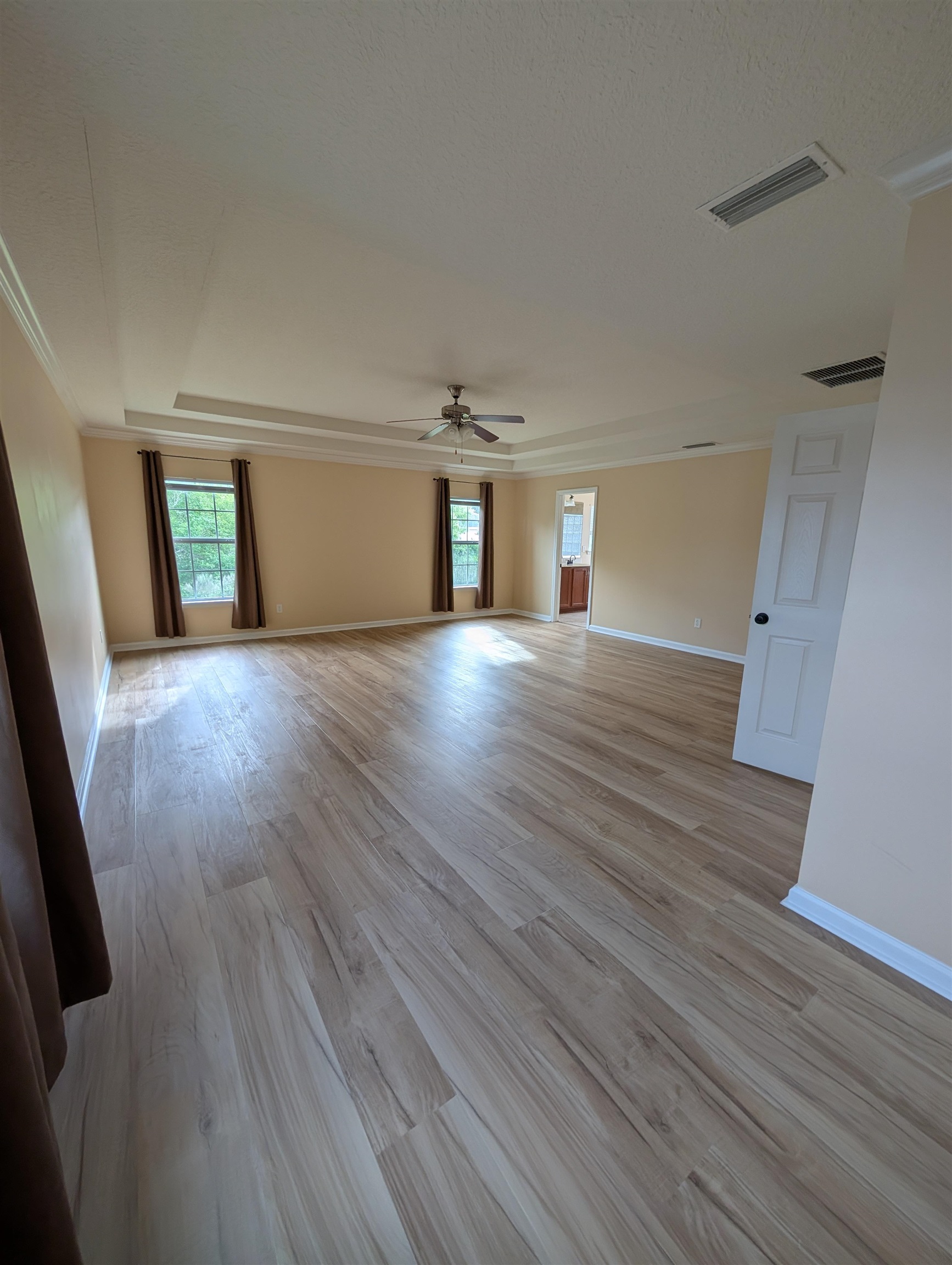 133 Camden Cay Drive St. Augustine, FL 32086 - Photo 26 of 33 a view of an empty room with wooden floor and a window