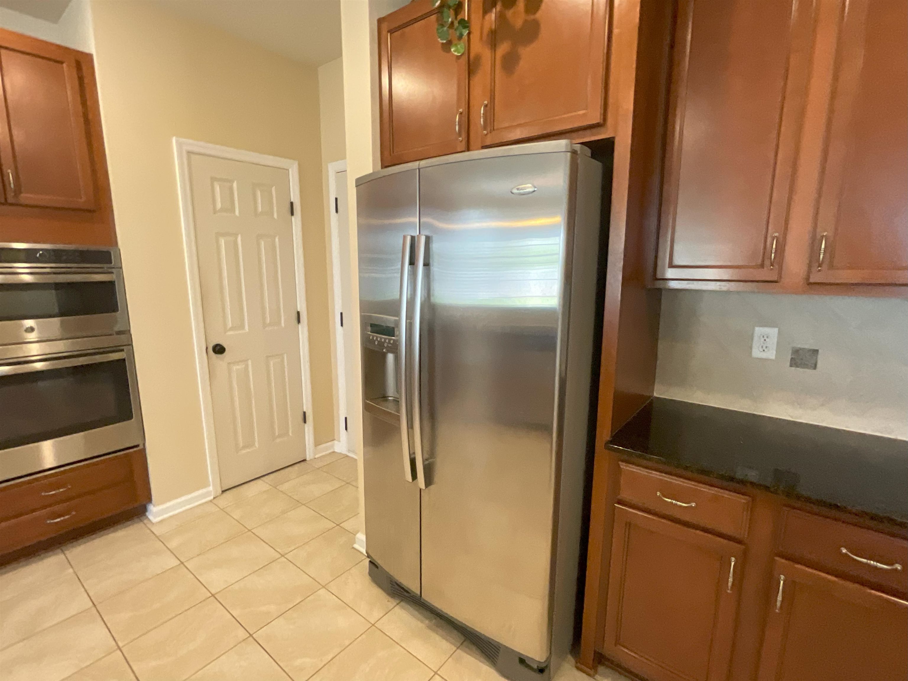 133 Camden Cay Drive St. Augustine, FL 32086 - Photo 4 of 33 a kitchen with metallic refrigerator freezer and a sink
