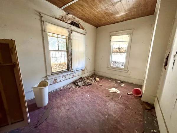 an empty room with windows