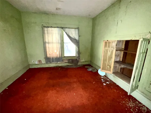 a bathroom with a green shower and a sink