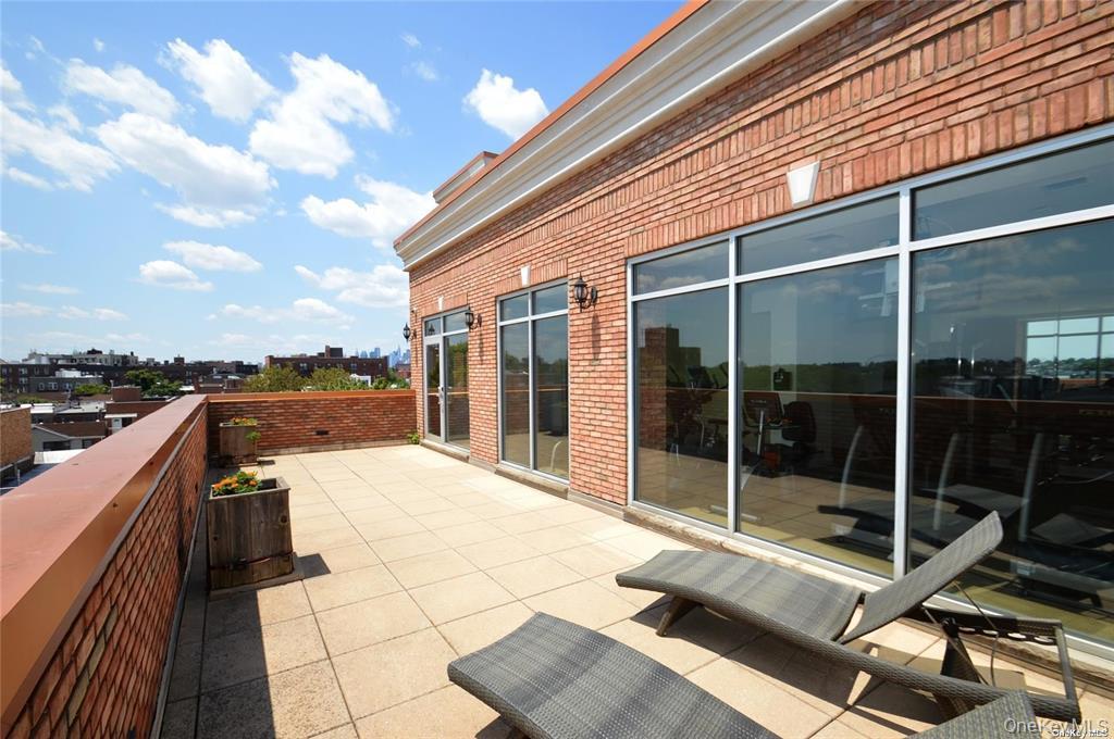 69-14 41st Avenue, Unit 401 Queens, NY 11377 - Photo 12 of 19 a view of a terrace with sky view