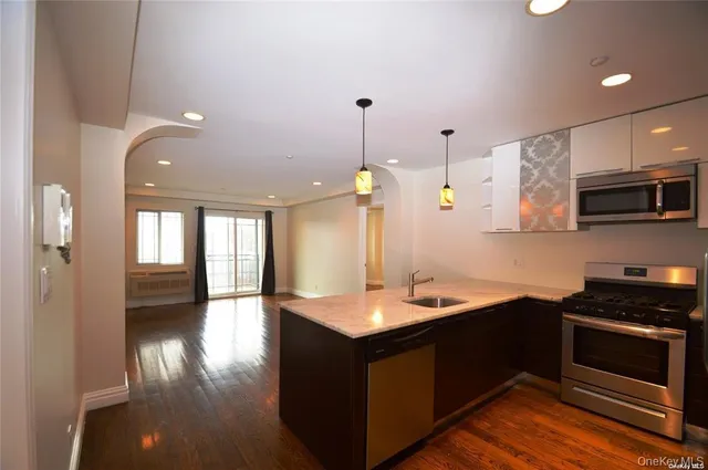 a car parked in front of a brick building