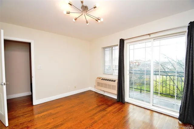 a kitchen with stainless steel appliances granite countertop a refrigerator a sink a stove and a refrigerator