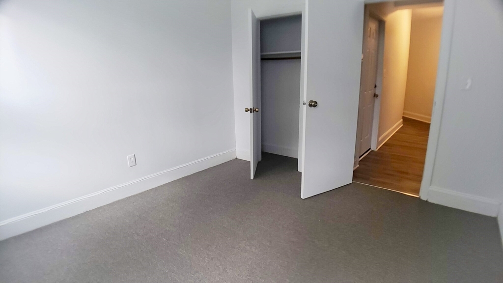 25 Chester Street, Unit 3 Boston, MA 02134 - Photo 12 of 14 a view of an empty room with wooden floor