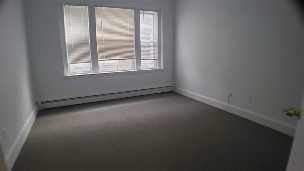 25 Chester Street, Unit 3 Boston, MA 02134 - Photo 5 of 14 an empty room with a window